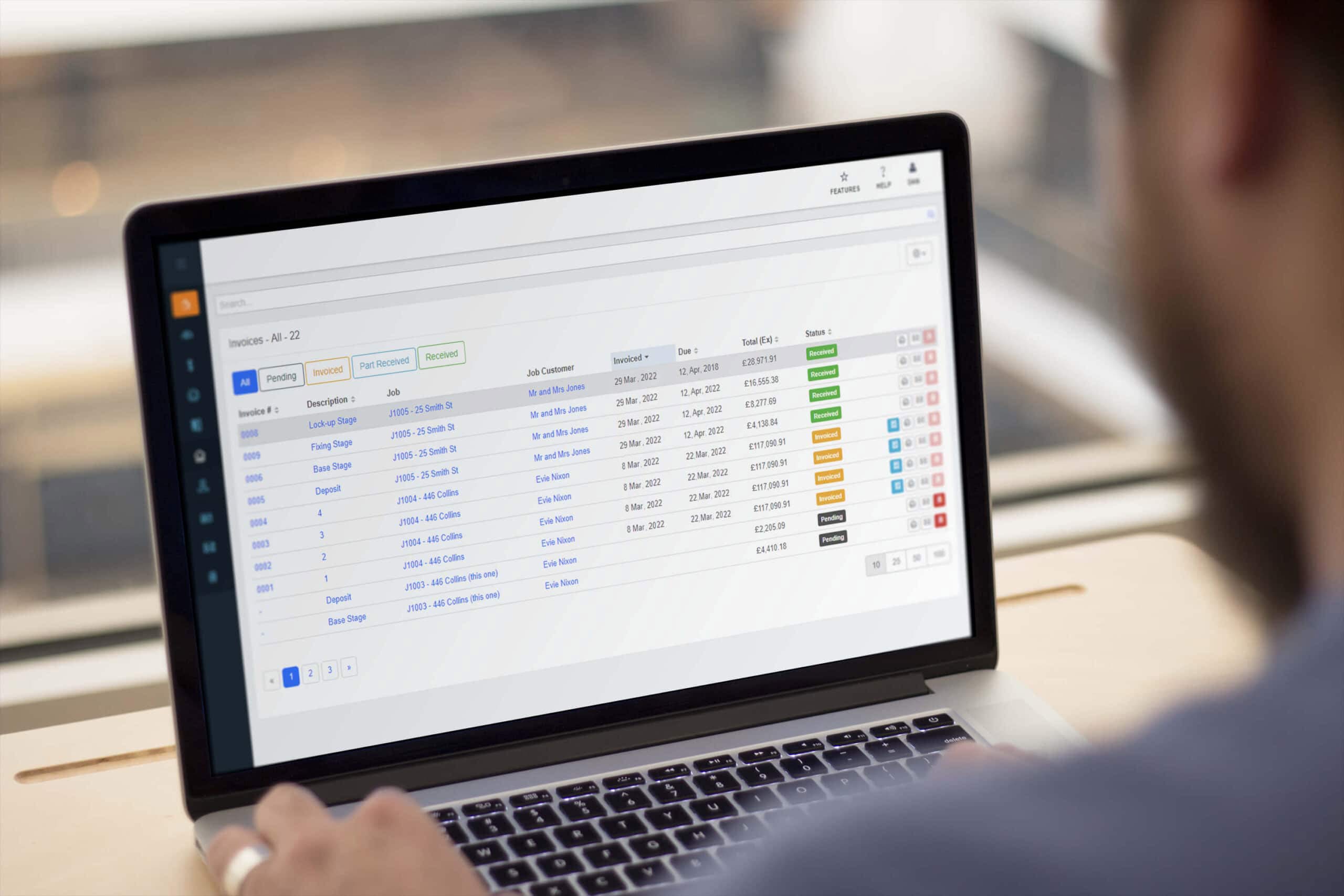 The Buildxact invoices and job management screen in a laptop