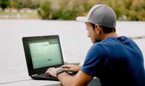 Home builder Ron Marcella checks on a project using Buildxact on his laptop.