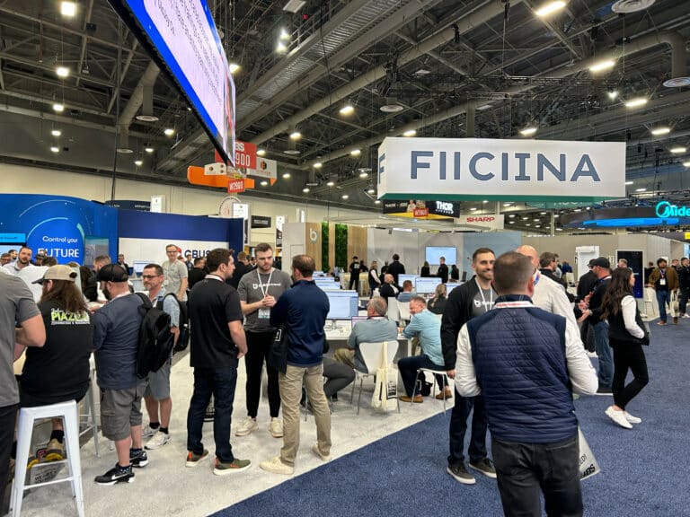 attendees of a builder show walk the show floor