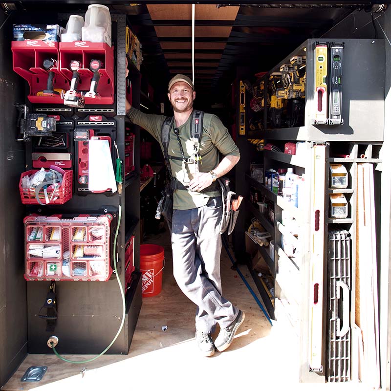 Builder Brian Yambor stands in his workshop